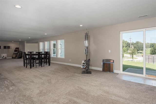 living area with baseboards, carpet, and recessed lighting