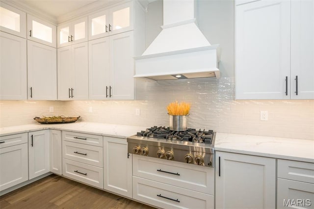 712 Silver Buck Ln, Chesterfield, MO 63005 - kitchen with custom exhaust hood, stainless steel gas stovetop, white cabinets, and decorative backsplash