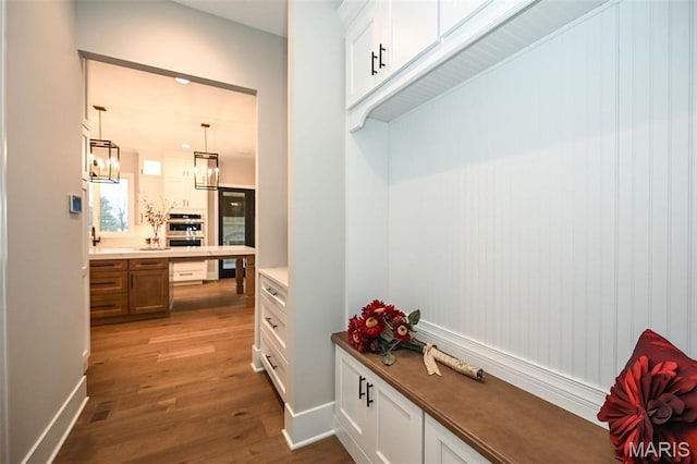 712 Silver Buck Ln, Chesterfield, MO 63005 - mudroom with dark wood-style flooring and a chandelier
