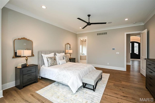 712 Silver Buck Ln, Chesterfield, MO 63005 - bedroom with ornamental molding, wood finished floors, arched walkways, recessed lighting, and ensuite bath