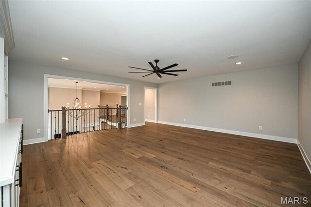 712 Silver Buck Ln, Chesterfield, MO 63005 - empty room featuring a chandelier, wood finished floors, ceiling fan, and recessed lighting