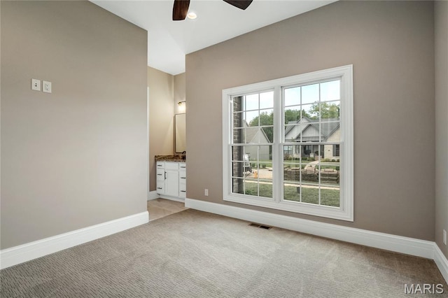 724 Silver Buck Ln, Chesterfield, MO 63005 - empty room featuring light carpet, a ceiling fan, and plenty of natural light