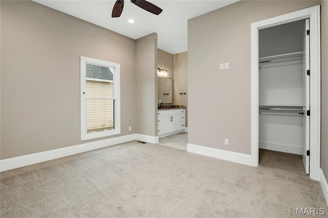724 Silver Buck Ln, Chesterfield, MO 63005 - unfurnished bedroom with light carpet, a spacious closet, a closet, ensuite bathroom, and recessed lighting