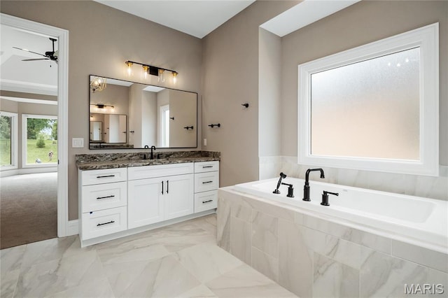 724 Silver Buck Ln, Chesterfield, MO 63005 - full bathroom featuring vanity, a bath, a ceiling fan, and marble finish flooring