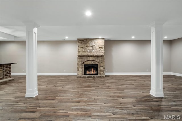 724 Silver Buck Ln, Chesterfield, MO 63005 - finished basement with a stone fireplace, wood finished floors, and recessed lighting