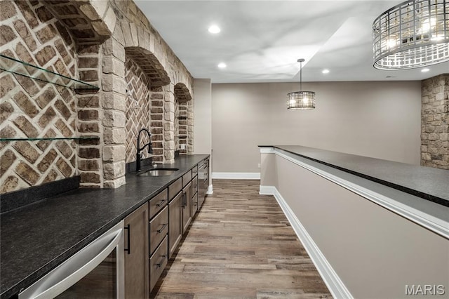 724 Silver Buck Ln, Chesterfield, MO 63005 - bar area featuring recessed lighting, wood finished floors, and hanging light fixtures