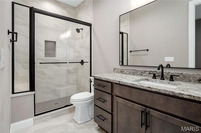 724 Silver Buck Ln, Chesterfield, MO 63005 - bathroom with marble look tile flooring, vanity, and a stall shower