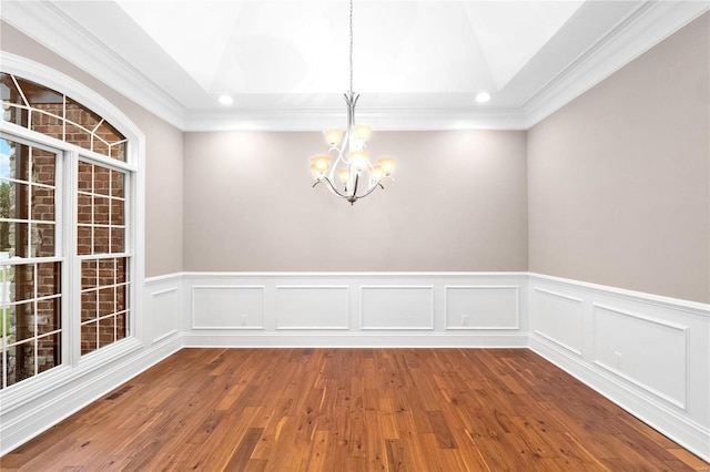 744 Silver Buck Ln, Chesterfield, MO 63005 - unfurnished dining area featuring a chandelier, vaulted ceiling, wood finished floors, crown molding, and wainscoting