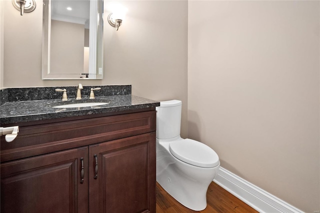 744 Silver Buck Ln, Chesterfield, MO 63005 - bathroom with toilet, wood finished floors, vanity, and baseboards