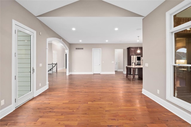 744 Silver Buck Ln, Chesterfield, MO 63005 - hall featuring arched walkways, wood finished floors, recessed lighting, and baseboards