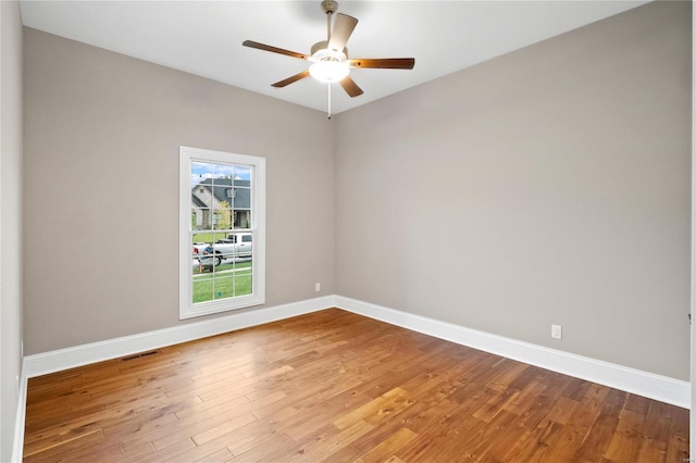 744 Silver Buck Ln, Chesterfield, MO 63005 - unfurnished room with wood finished floors, baseboards, and a ceiling fan