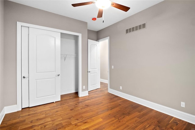 744 Silver Buck Ln, Chesterfield, MO 63005 - unfurnished bedroom featuring baseboards, wood finished floors, a closet, and a ceiling fan