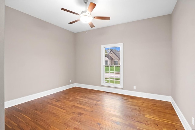 744 Silver Buck Ln, Chesterfield, MO 63005 - unfurnished room with wood finished floors, baseboards, and ceiling fan