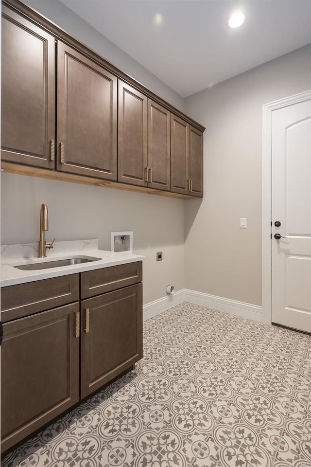 laundry room featuring hookup for an electric dryer, cabinet space, hookup for a washing machine, baseboards, and recessed lighting