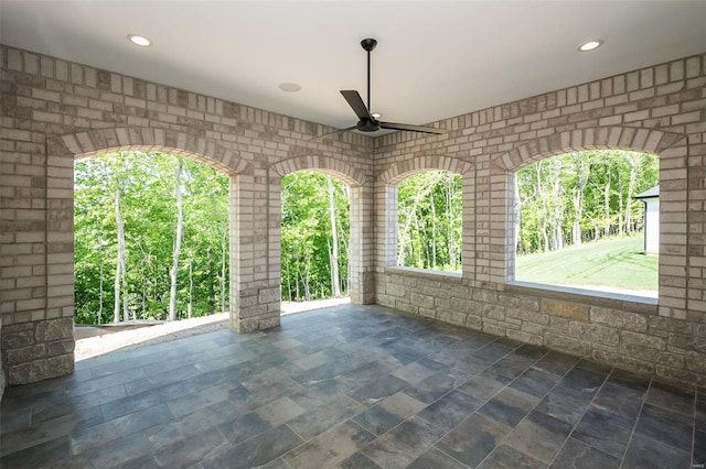 view of patio featuring ceiling fan