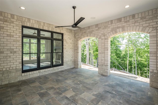 view of patio featuring a ceiling fan and french doors