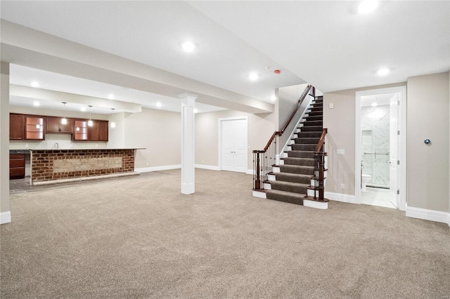 finished basement with stairs, light carpet, baseboards, and recessed lighting