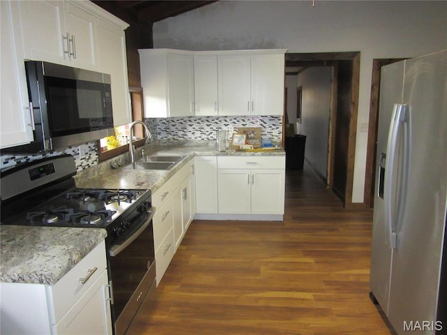 607 County Road 423, Poplar Bluff, MO 63901 - kitchen with gas stove, fridge with ice dispenser, stainless steel microwave, tasteful backsplash, and dark wood-style flooring