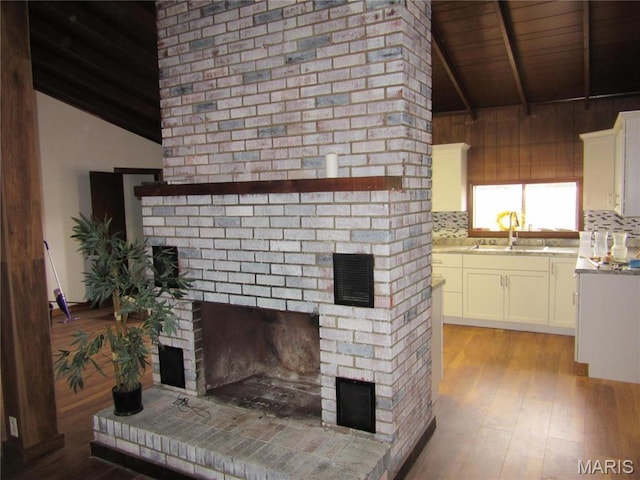 607 County Road 423, Poplar Bluff, MO 63901 - unfurnished living room with a fireplace, light wood-style floors, and wood ceiling