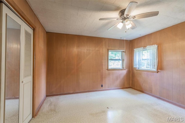 607 County Road 423, Poplar Bluff, MO 63901 - spare room featuring wooden walls and ceiling fan