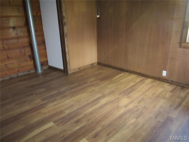 607 County Road 423, Poplar Bluff, MO 63901 - empty room with wood finished floors and wooden walls