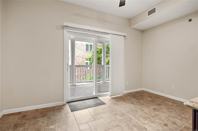 505 N And S Rd Unit 3C, University City, MO 63130 - doorway to outside featuring stone tile flooring, baseboards, and ceiling fan