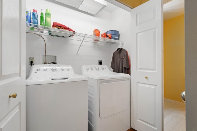 505 N And S Rd Unit 3C, University City, MO 63130 - laundry room featuring washer and dryer and light tile patterned flooring