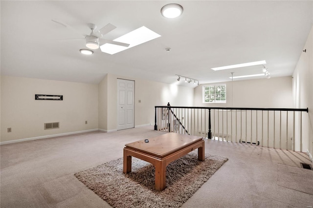 505 N And S Rd Unit 3C, University City, MO 63130 - sitting room with a skylight, carpet, rail lighting, and ceiling fan
