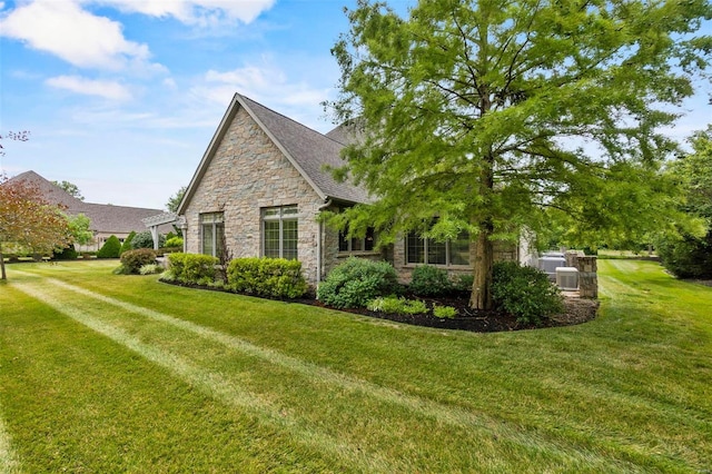111 Crosshill Ct, Cape Girardeau, MO 63701 - view of side of property featuring stone siding, a yard, and roof with shingles