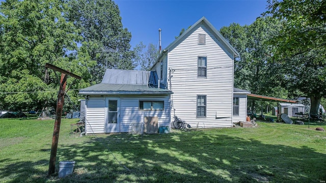 3340 Stonehouse Rd, De Soto, MO 63020 - back of house with a yard and metal roof