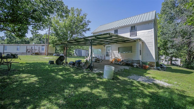 3340 Stonehouse Rd, De Soto, MO 63020 - back of house featuring a lawn, metal roof, and entry steps