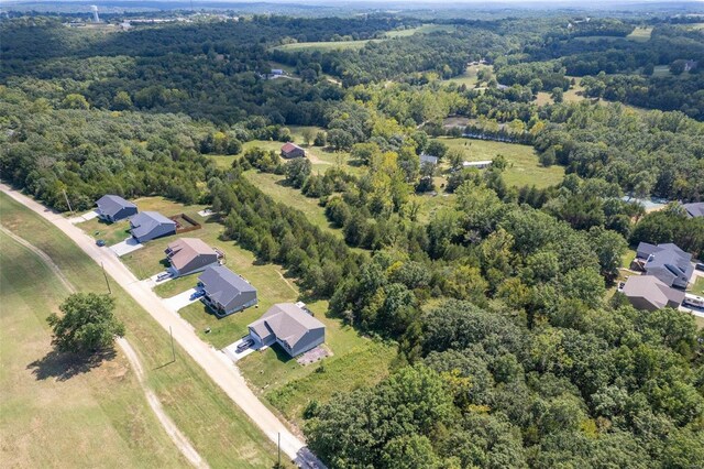 3340 Stonehouse Rd, De Soto, MO 63020 - aerial perspective of suburban area featuring a forest