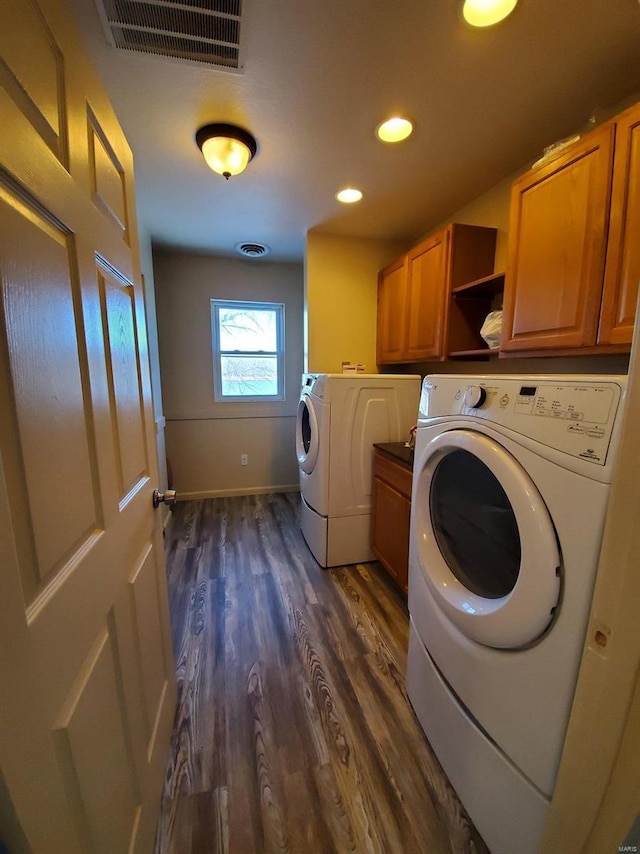 801 S Front St, La Grange, MO 63448 - laundry room featuring independent washer and dryer, cabinet space, dark wood-style floors, recessed lighting, and baseboards
