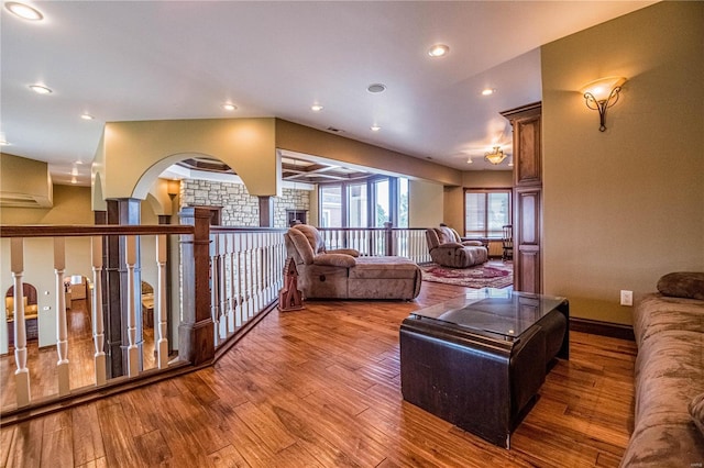 6708 Brown Ln, Poplar Bluff, MO 63901 - living area featuring wood finished floors, recessed lighting, baseboards, and arched walkways