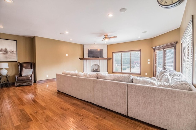 6708 Brown Ln, Poplar Bluff, MO 63901 - living room featuring wood finished floors, a ceiling fan, recessed lighting, and a fireplace