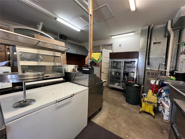 207 S Main St, Hannibal, MO 63401 - kitchen featuring unfinished concrete floors