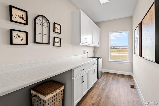 4 Challenger Ct, Ofallon, MO 63366 - washroom with cabinet space, baseboards, wood finished floors, and hookup for a washing machine