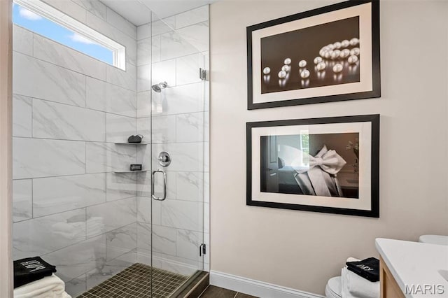 4 Challenger Ct, Ofallon, MO 63366 - bathroom with toilet, a stall shower, vanity, and baseboards