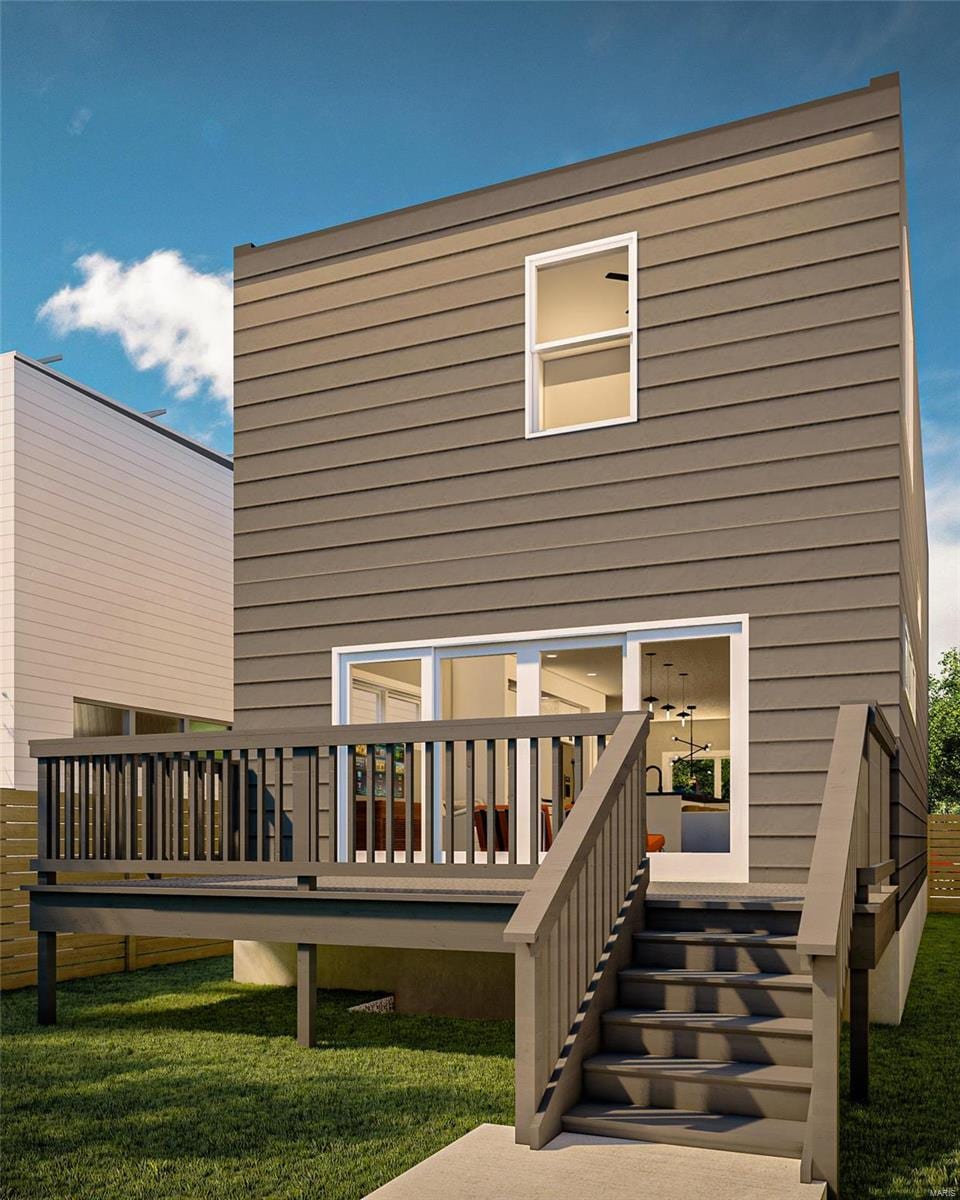 1410 Monroe St, Saint Louis, MO 63106 - back of house with a wooden deck and a lawn