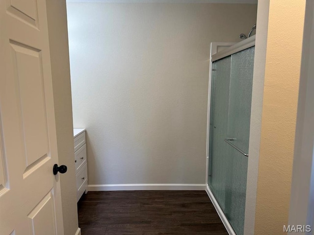 902 C St, Malden, MO 63863 - full bath with wood finished floors, vanity, baseboards, and an enclosed shower