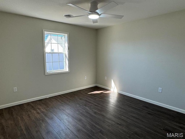902 C St, Malden, MO 63863 - unfurnished room featuring a ceiling fan, dark wood-style floors, and baseboards