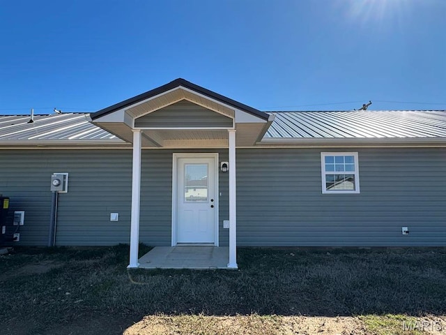 902 C St, Malden, MO 63863 - property entrance featuring metal roof