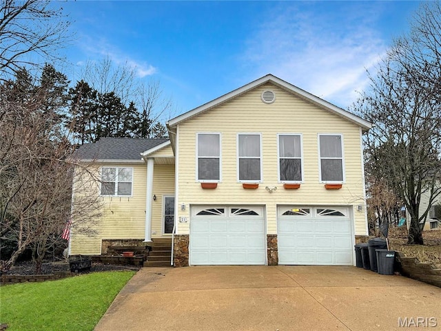21 Forest Ln, Union, MO 63084 - tri-level home with an attached garage, driveway, and stone siding