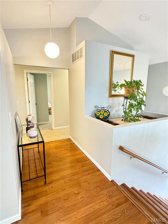 21 Forest Ln, Union, MO 63084 - corridor featuring lofted ceiling, wood finished floors, and baseboards