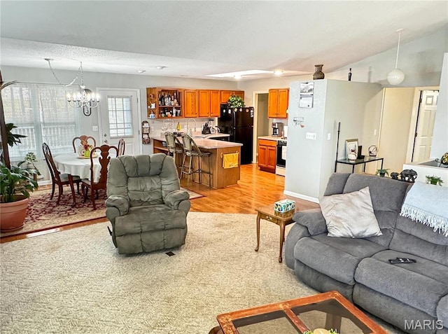 21 Forest Ln, Union, MO 63084 - living room with light wood-style floors, a chandelier, and lofted ceiling