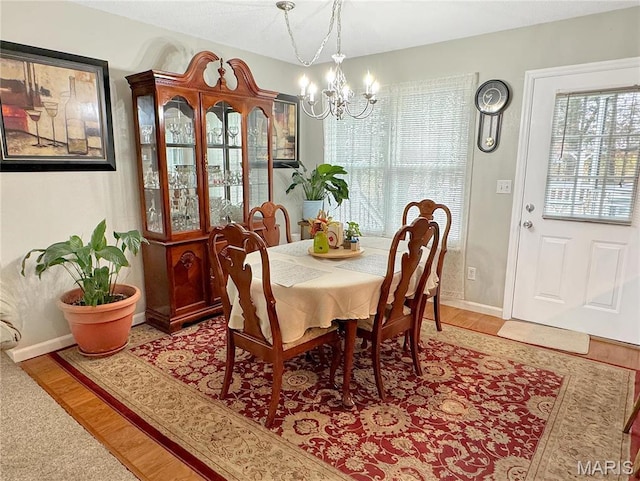 21 Forest Ln, Union, MO 63084 - dining room featuring a chandelier, wood finished floors, and baseboards