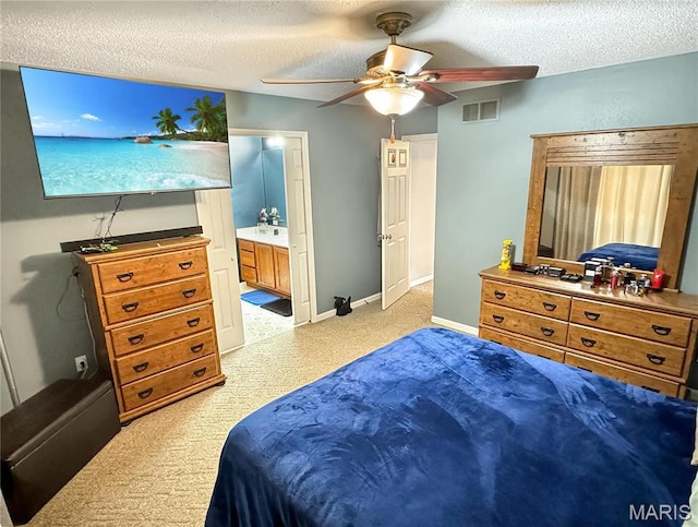 21 Forest Ln, Union, MO 63084 - bedroom with light carpet, a textured ceiling, a ceiling fan, baseboards, and ensuite bathroom