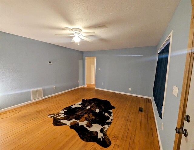 1035 Park Ave, Poplar Bluff, MO 63901 - empty room featuring hardwood / wood-style flooring, a ceiling fan, and baseboards