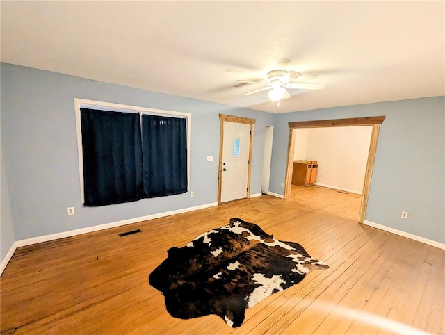 1035 Park Ave, Poplar Bluff, MO 63901 - spare room with wood-type flooring, baseboards, and a ceiling fan