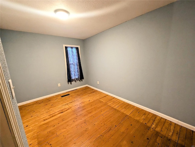 1035 Park Ave, Poplar Bluff, MO 63901 - spare room featuring baseboards and hardwood / wood-style flooring